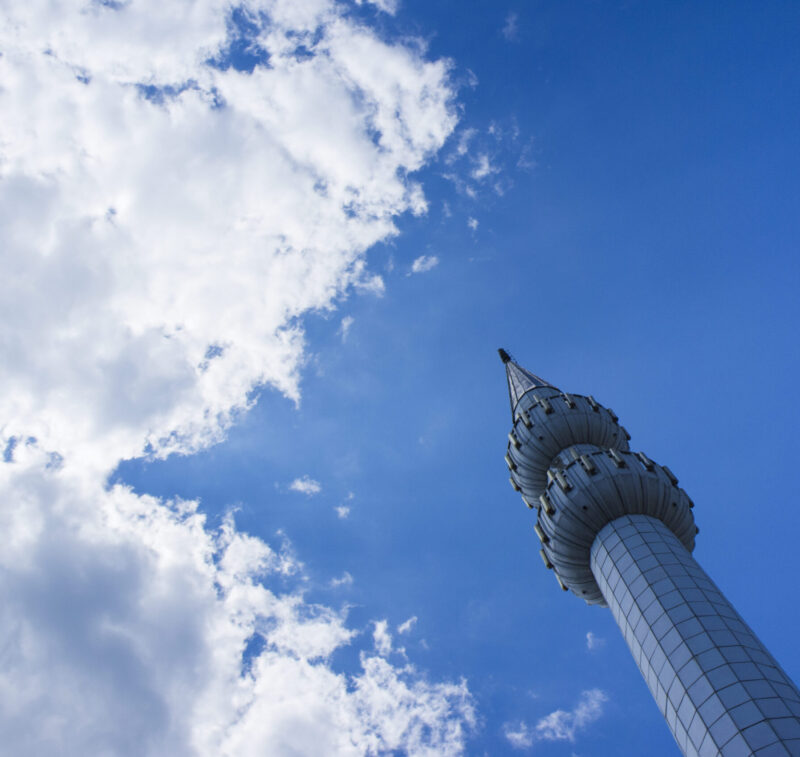 Low angle view of tower against cloudy sky