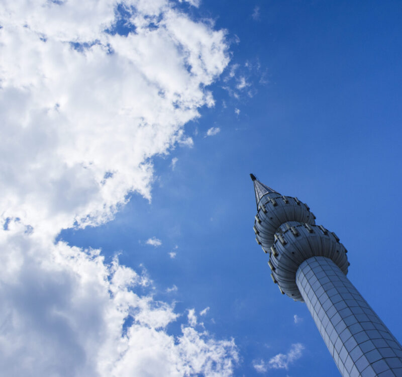 Low angle view of tower against cloudy sky